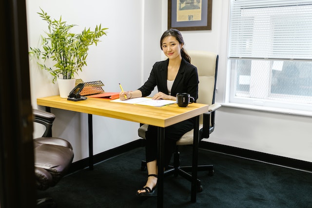 property manager sitting at their desk writing